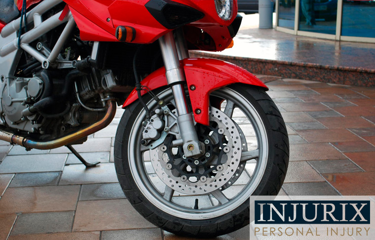 image of front wheel of a red sport motorcycle