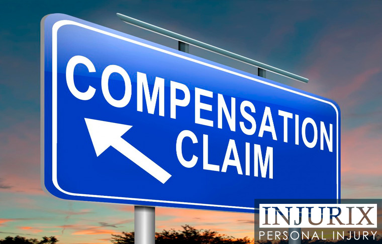 blue sign that reads “Compensation Claim”